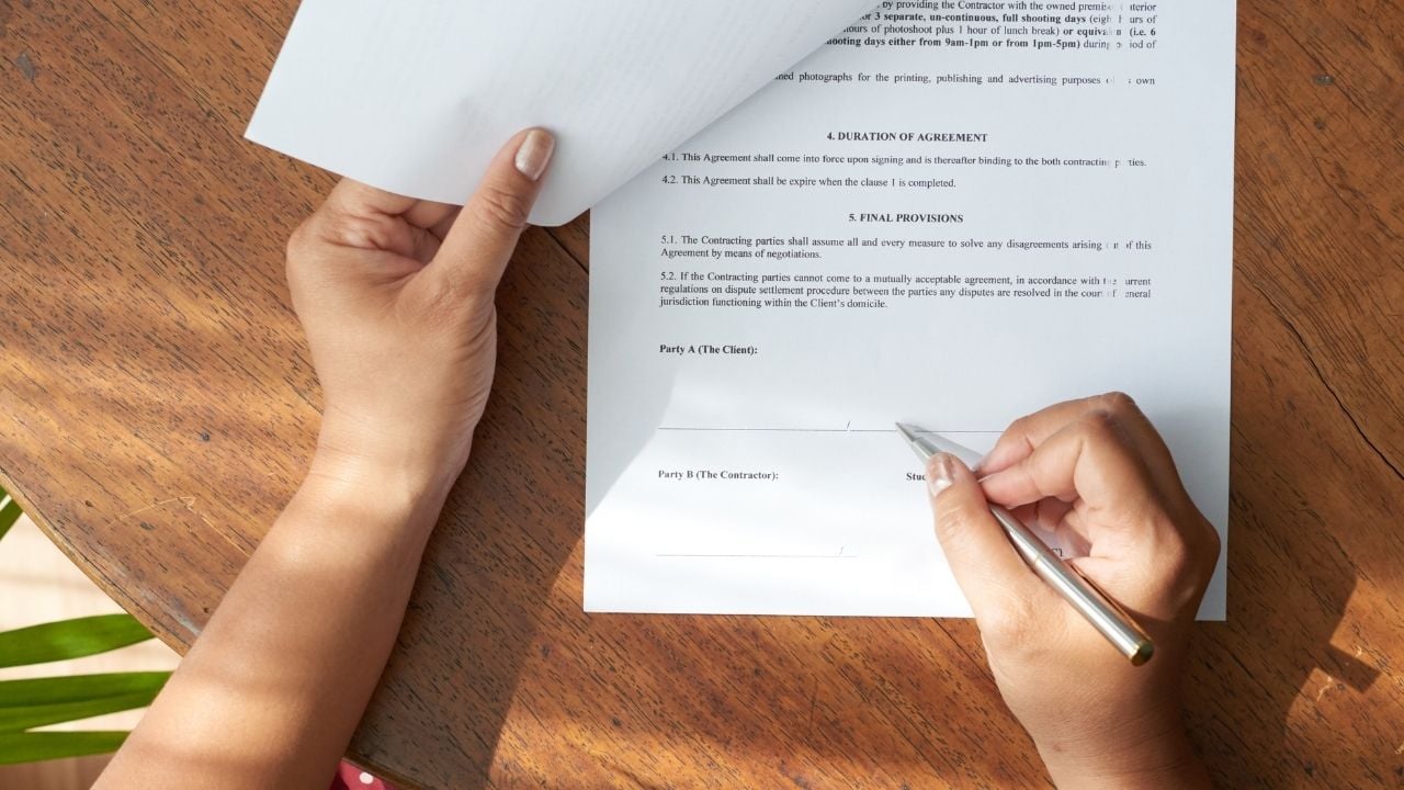 person signing a contract